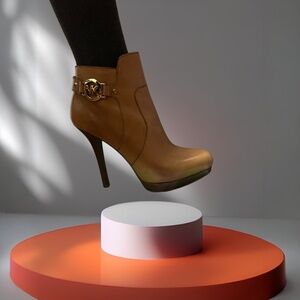 MK high heel ankle boot with iconic “MK” hardware. Caramel color. Size 9 ½